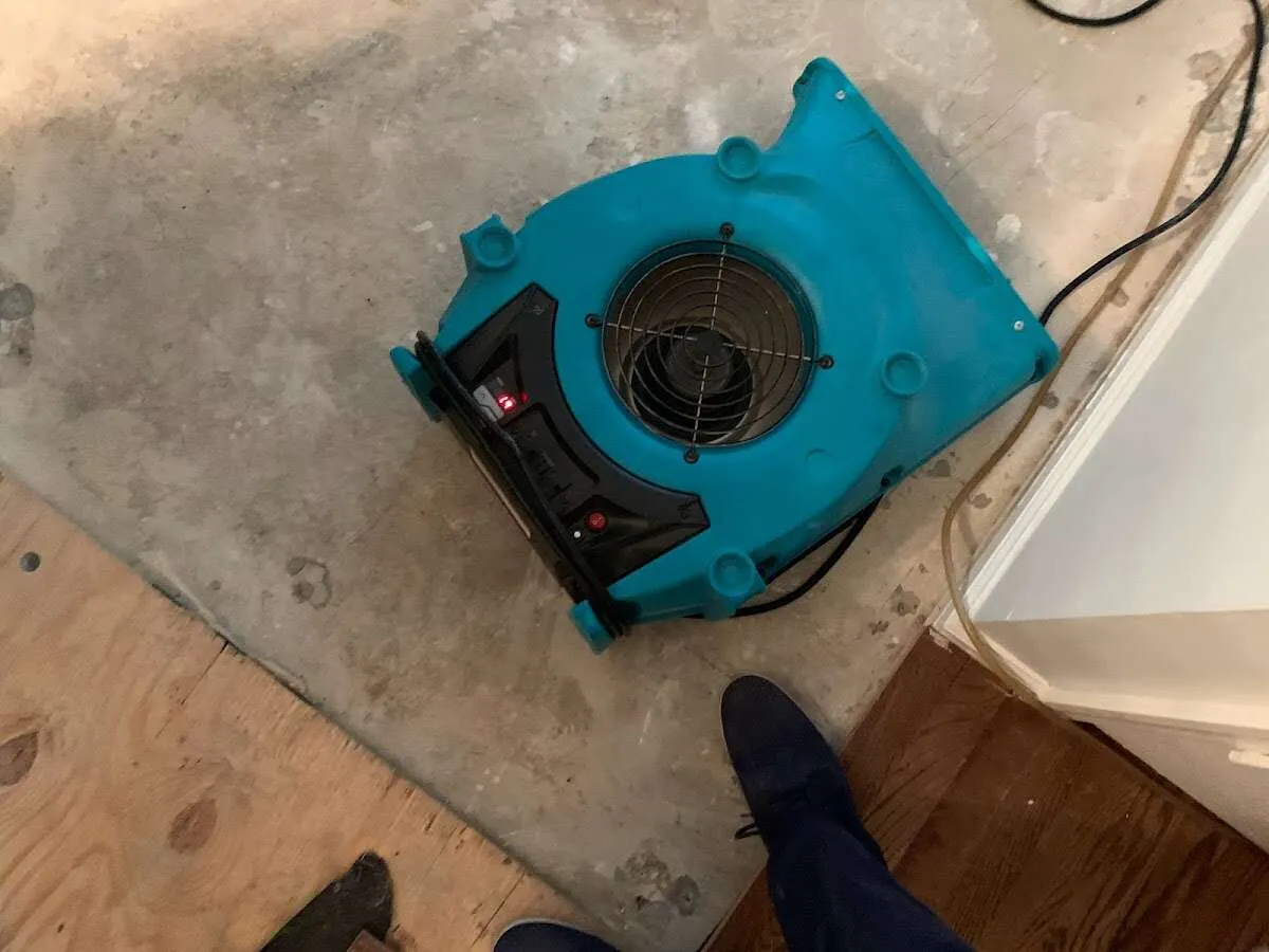 Air mover drying subfloor during Leak Detection & Repair in Union Gap